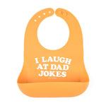 Bella Tunno I Laugh at Dad Jokes Wonder Bib in orange, featuring a "I Laugh at Dad Jokes" design, adjustable neck, and a catch pocket, made from BPA-free silicone, available at Be Charmed