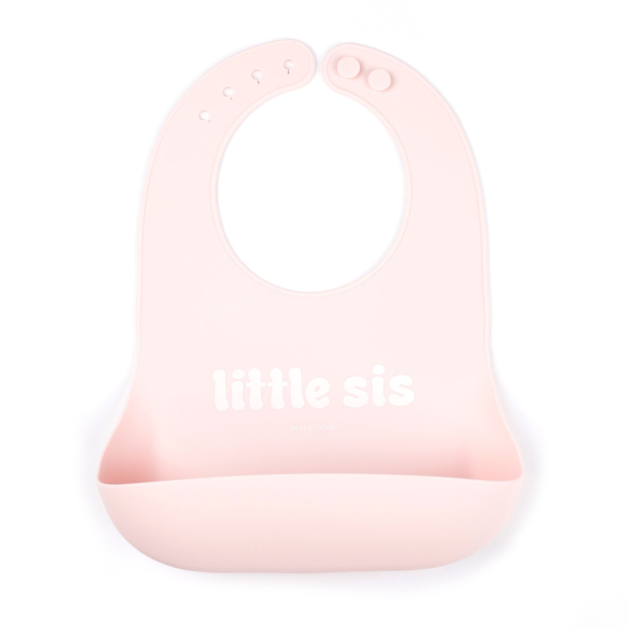 Bella Tunno "Little Sis" Wonder Bib in pink, featuring a generous catch pocket and adjustable neck closure, available at Be Charmed.
