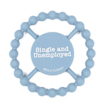 Bella Tunno Single and Unemployed Teether in pastel blue, featuring a humorous "Single and Unemployed" message, made from BPA-free silicone, available at Be Charmed