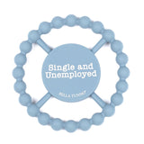 Bella Tunno Single and Unemployed Teether in pastel blue, featuring a humorous "Single and Unemployed" message, made from BPA-free silicone, available at Be Charmed