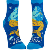 Blue socks with mermaid design and 'Deep Sea Diva' text on a white background. Available at Be Charmed