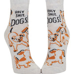 Pair of socks with dog illustrations and text on a white background. Available at Be Charmed