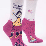 Pair of socks with cartoon character and text 'I'm Not bossy, I'm the BOSS' on a white background. Available at Be Charmed