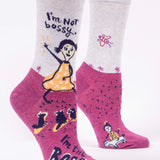 Pair of socks with cartoon character and text 'I'm Not bossy, I'm the BOSS' on a white background. Available at Be Charmed