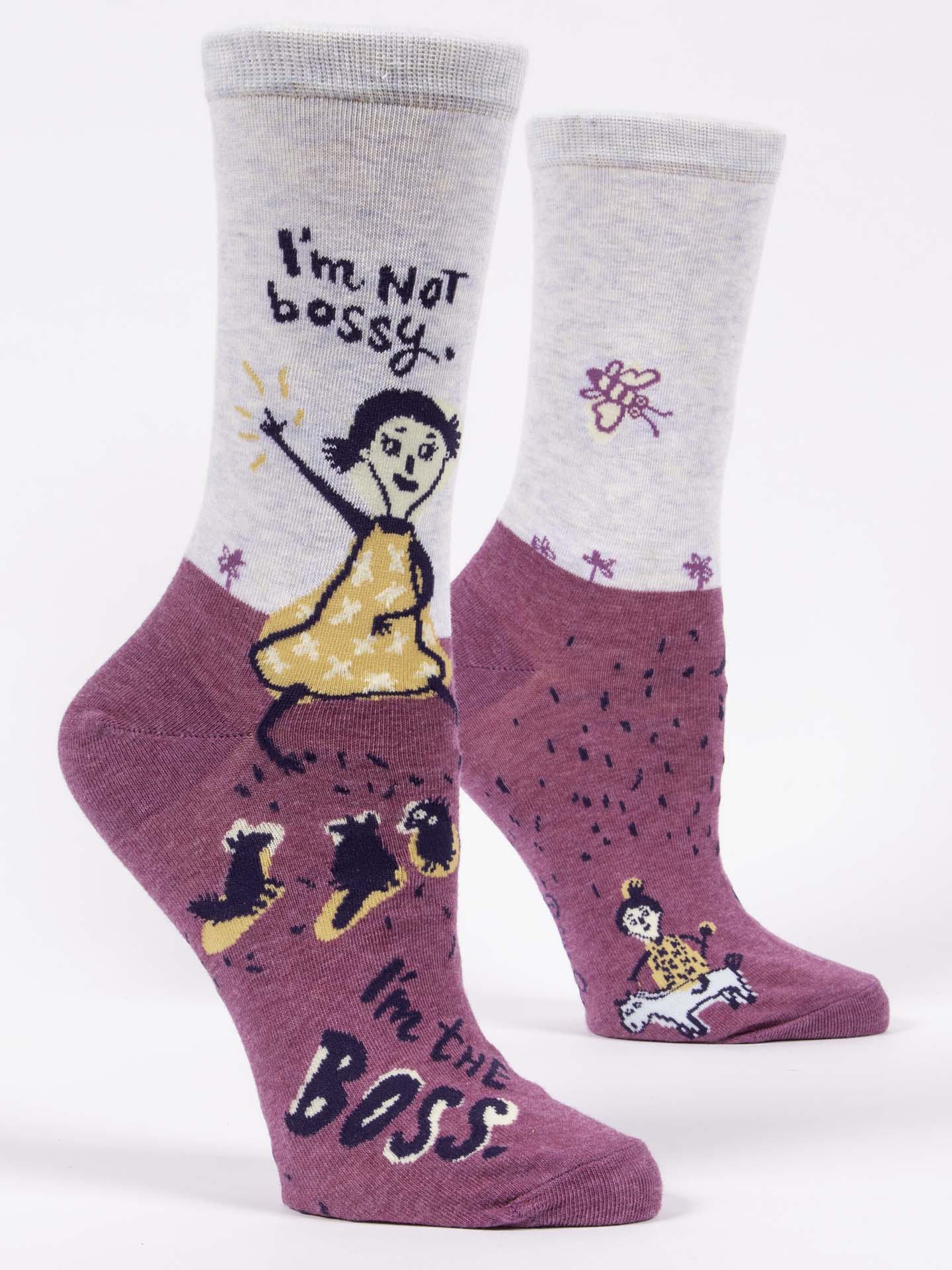 Pair of socks with cartoon character and text 'I'm Not bossy, I'm the BOSS' on a white background. Available at Be Charmed