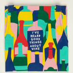 Folded Good Things About Wine apron – cheeky kitchen apron with witty wine design, available at Be Charmed.