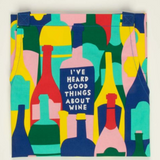 Folded Good Things About Wine apron – cheeky kitchen apron with witty wine design, available at Be Charmed.