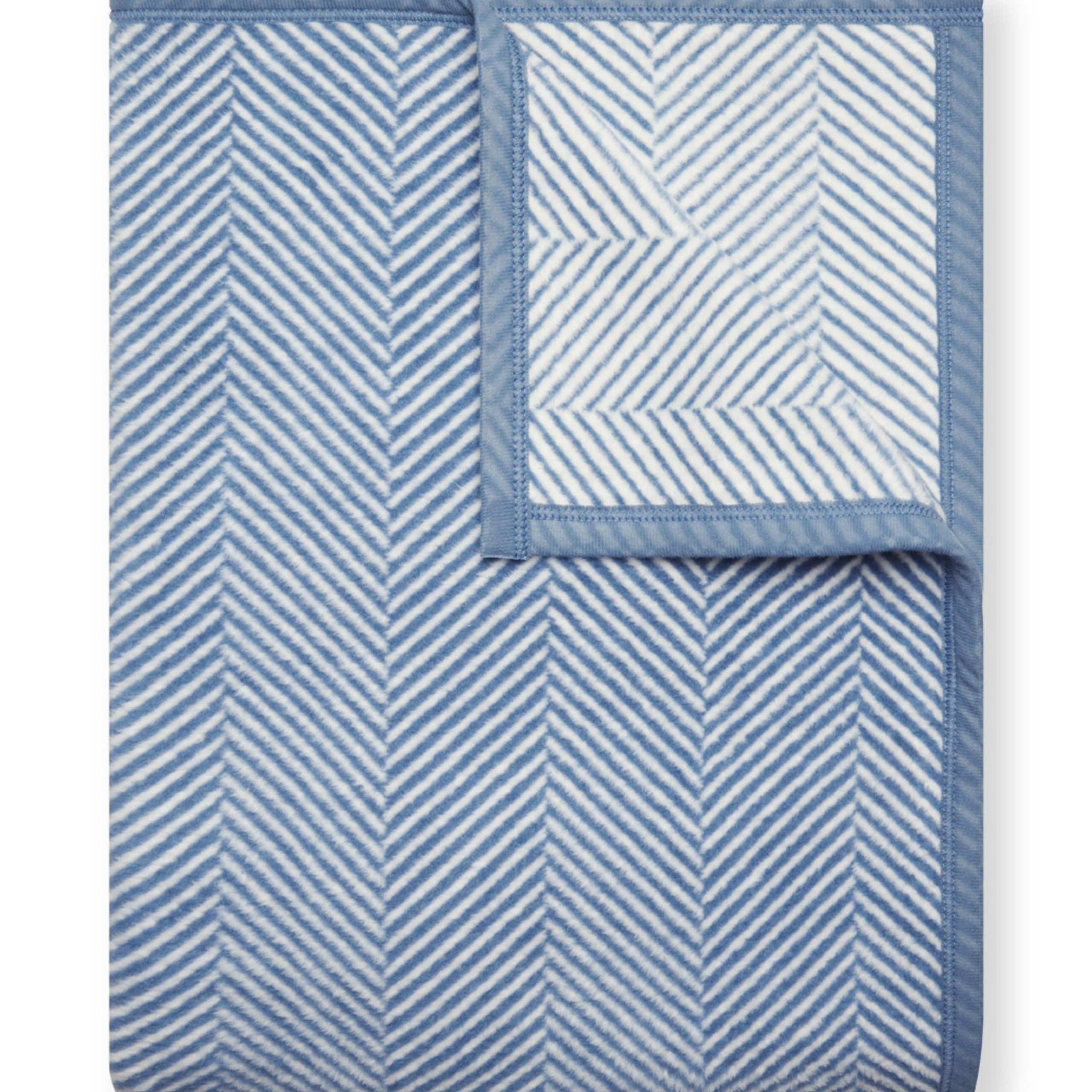 Cornflower Chappy Wrap Harborview Herringbone Blanket – Original size throw in a classic light grey herringbone pattern. Plush, durable, and machine washable. A cozy neutral accent for the home or perfect gift. Available at Be Charmed.