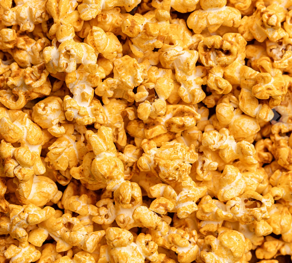 Close of Picture of Poppy Handcrafted Popcorn Pimento Cheese Snack Bag featuring bold Southern-style cheddar and pepper flavor in a cheesy, savory gourmet snack, available at Be Charmed