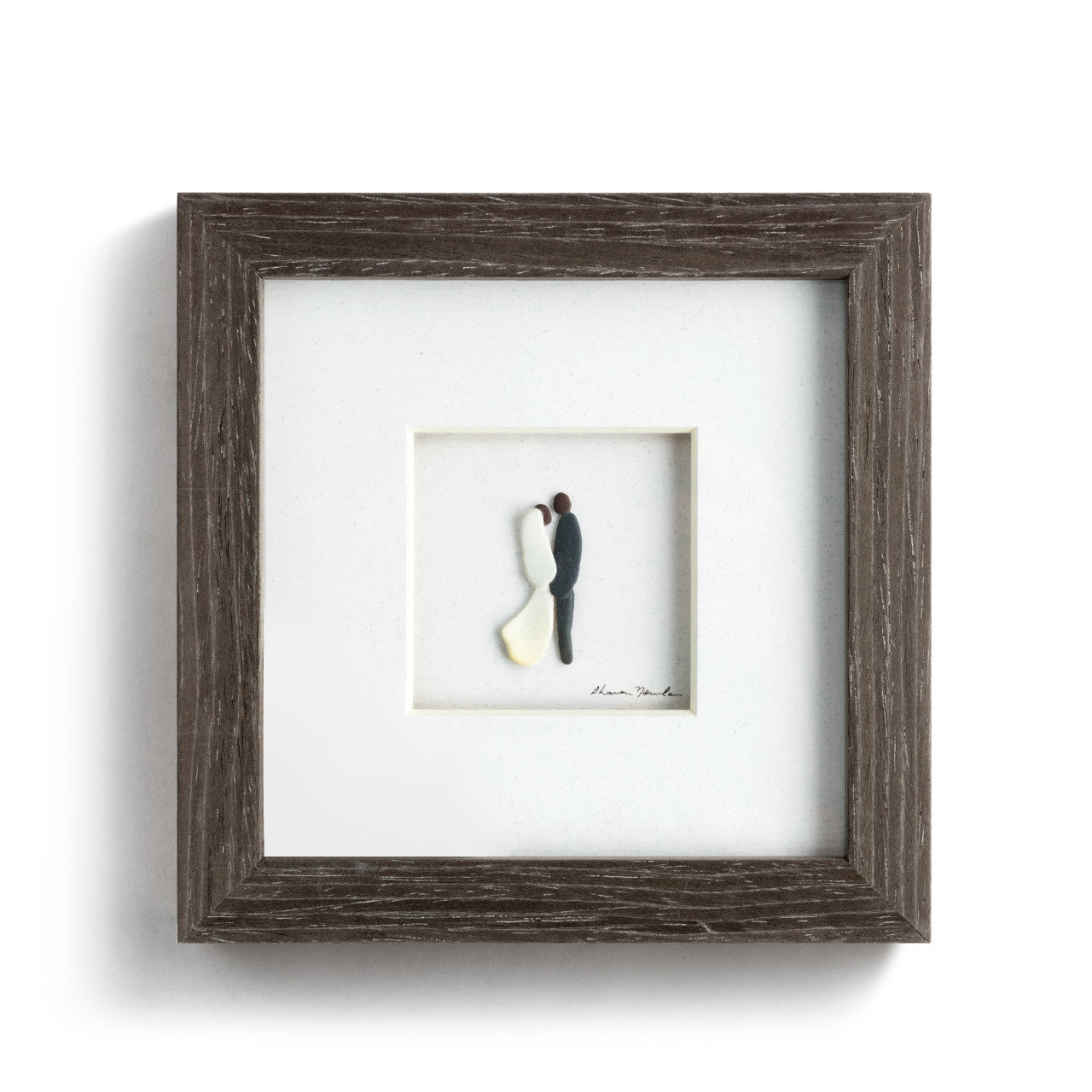 Demdaco “I Do” framed gray wall art by Sharon Nowlan, pebble art design depicting engagement scene—Available at Be Charmed.