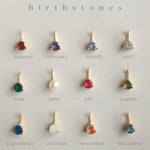 Close up of fyb gold birthstone charms. Available at Be Charmed