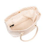 Quilted beige handbag with a strap on a white background