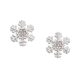 Snowflake-shaped stud earrings with clear gemstones on a white background. Available at Be Charmed.