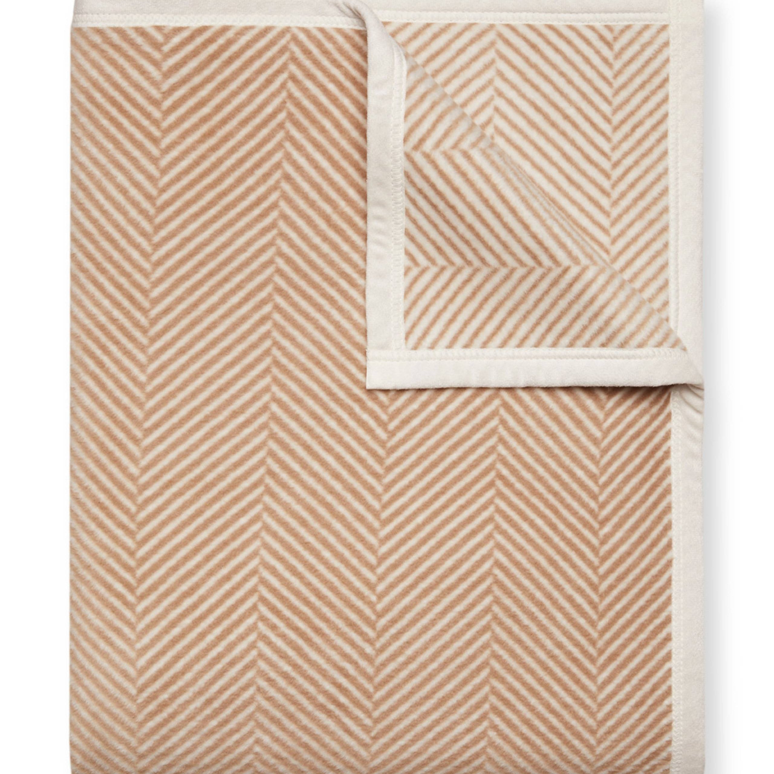 Tan Chappy Wrap Harborview Herringbone Blanket – Original size throw in a classic light grey herringbone pattern. Plush, durable, and machine washable. A cozy neutral accent for the home or perfect gift. Available at Be Charmed.