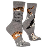 Gray socks with cat illustrations and text on a white background. Available at Be Charmed