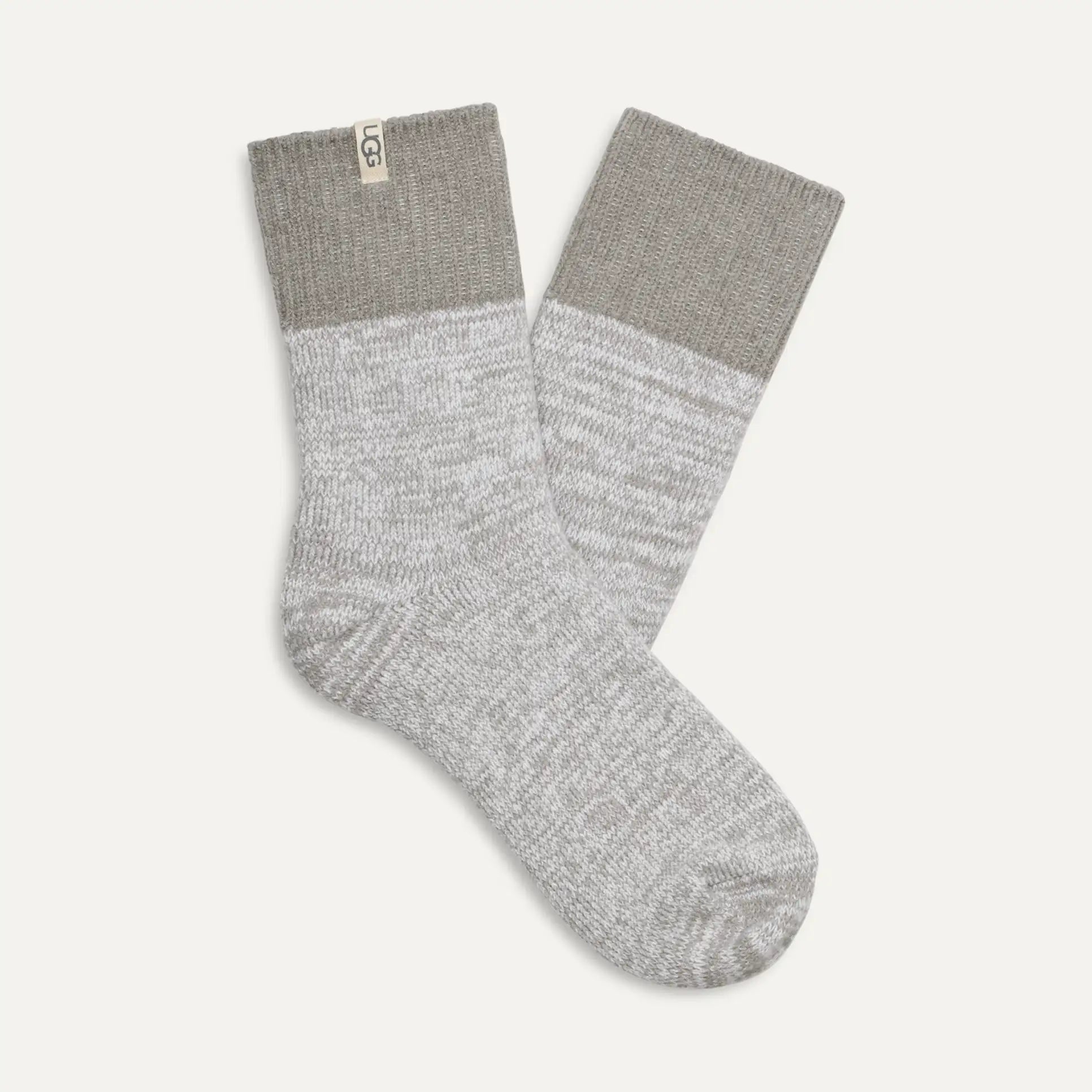 Gray socks with a ribbed texture on a light gray background. Available at Be Charmed