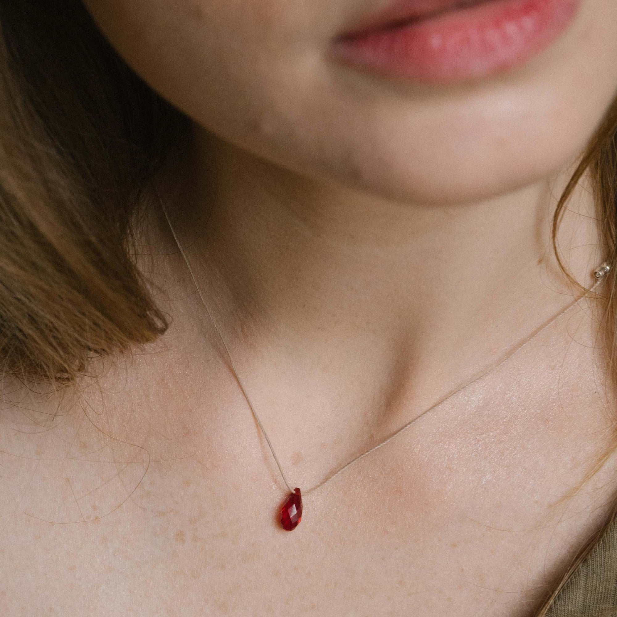 Woman wearing &LIVY Gold Hyevibe Crystal Slider Siam Necklace