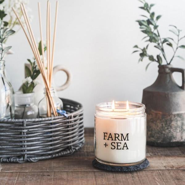 Farm + Sea Grapefruit & Sea Salt 14 oz Candle Lit on Table