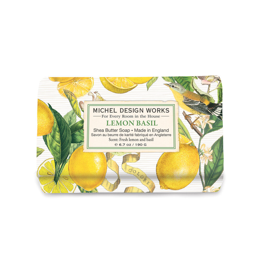 Michel Design Works Lemon Basil soap bar with decorative packaging featuring lemons and leaves on a white background. Available at Be Charmed