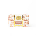 Gingerbread-themed soap bar in a decorative packaging on a white background. Available at Be Charmed. 