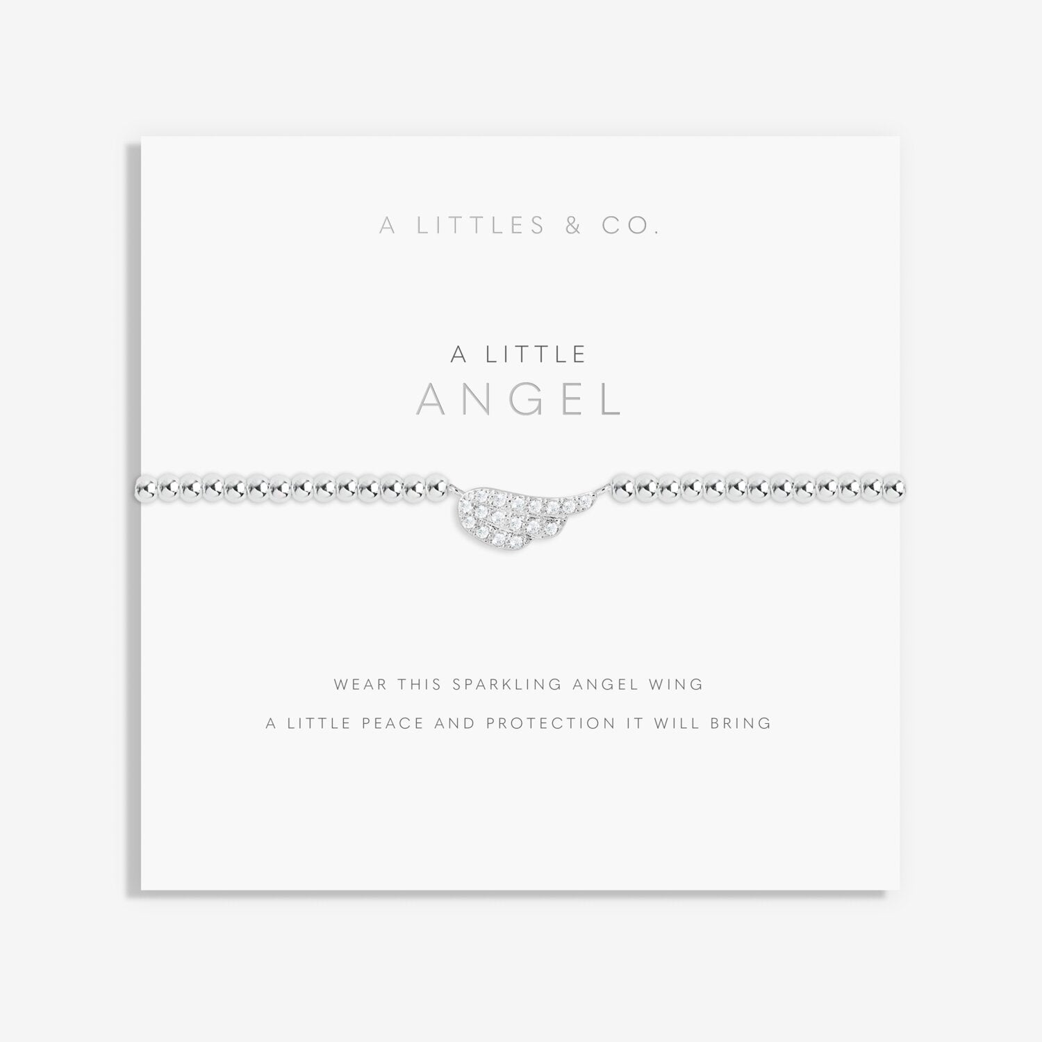 Silver angel wing necklace on a white card with 'A Littles & Co' branding. Available at Be Charmed