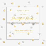 Bracelet with heart charms on a decorative card with 'A Littles & Co.' branding. Available at Be Charmed