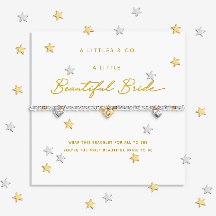 Bracelet with heart charms on a decorative card with 'A Littles & Co.' branding. Available at Be Charmed
