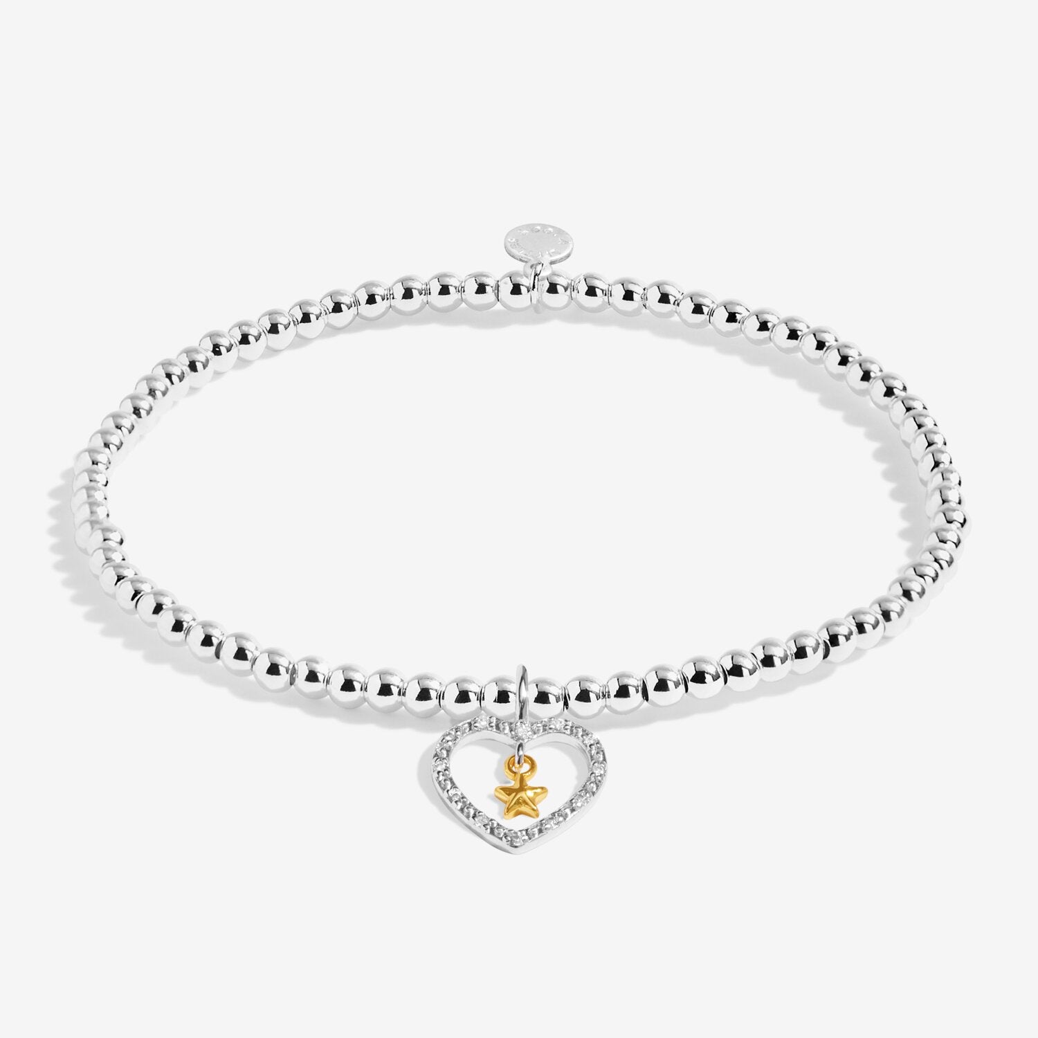 Silver bracelet with a heart-shaped charm on a white background. Available at Be Charmed