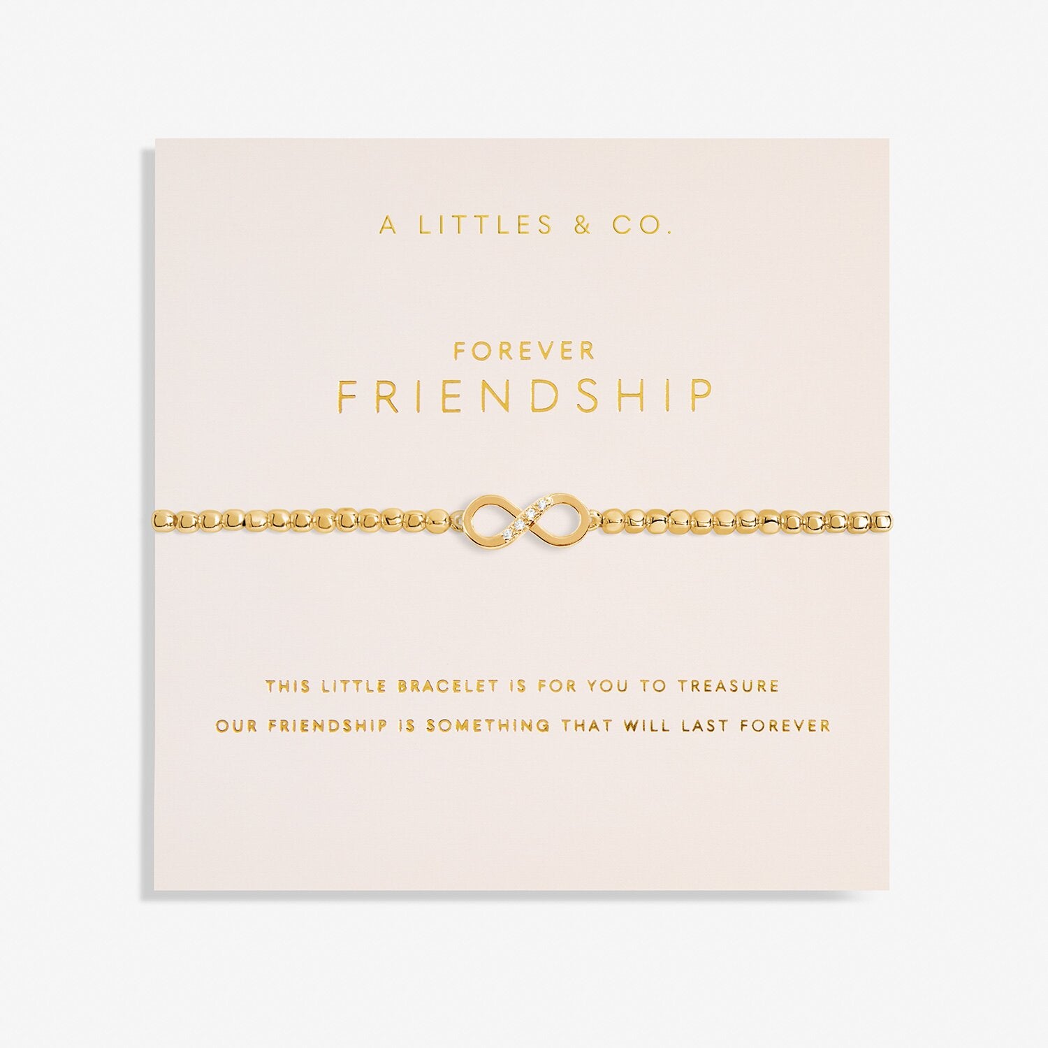Gold bracelet on a 'Forever Friendship' card with 'A Littles & Co.' branding. Available at Be Charmed