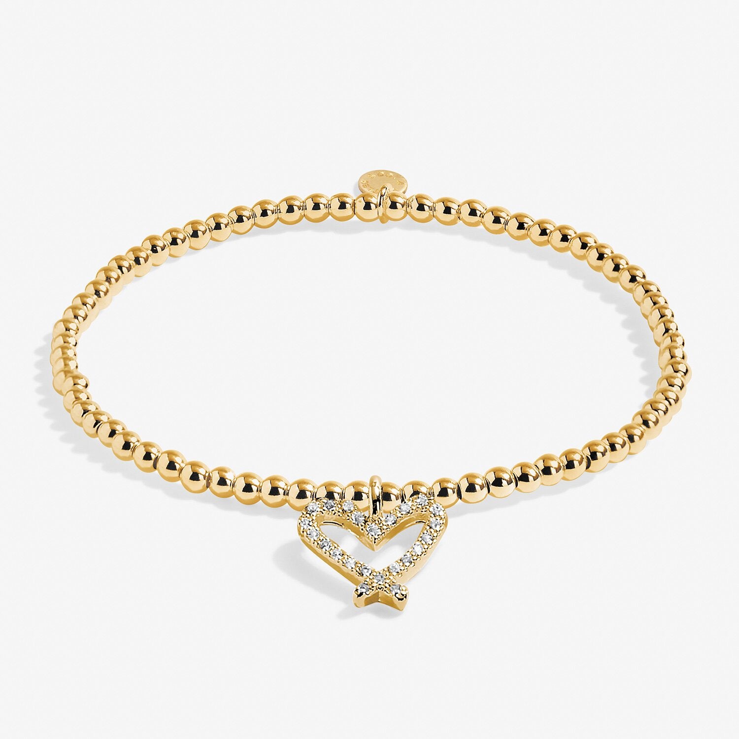 Gold bracelet with a heart-shaped clasp on a white background. Available at Be Charmed
