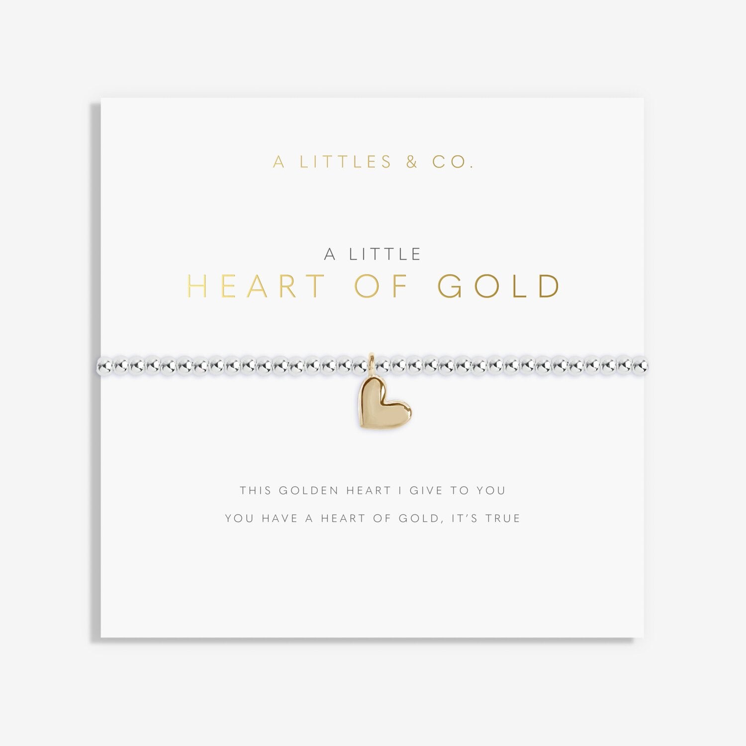 Gold heart bracelet on a white card with 'A Littles & Co' branding. Available at Be Charmed