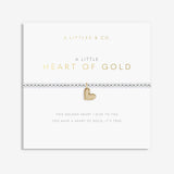 Gold heart bracelet on a white card with 'A Littles & Co' branding. Available at Be Charmed