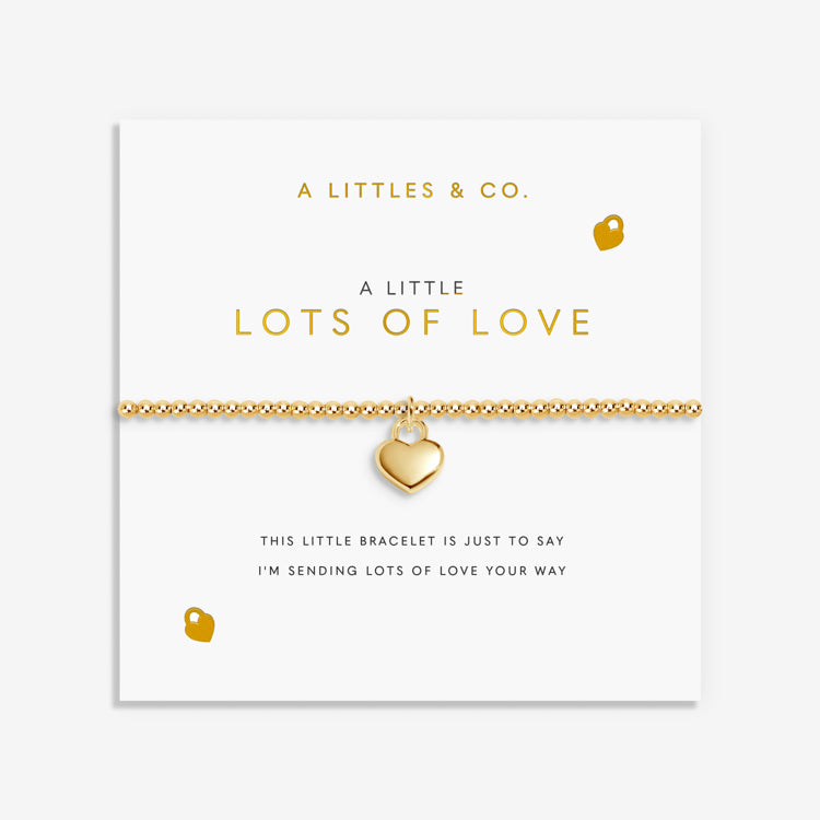 Gold heart bracelet on a card with 'A Littles & Co.' branding. Available at Be Charmed