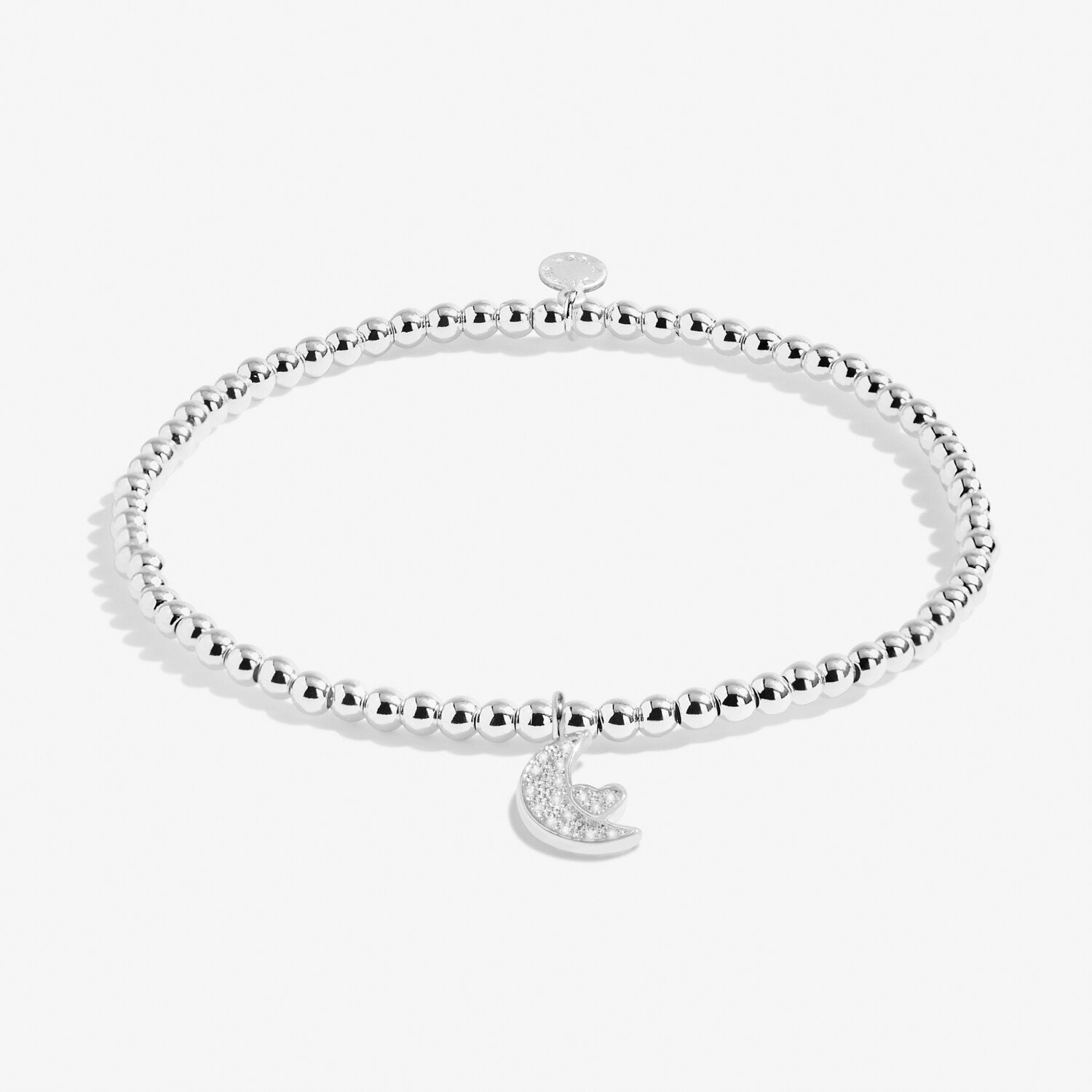 Silver beaded bracelet with a moon and star charm on a white background. Available at Be Charmed