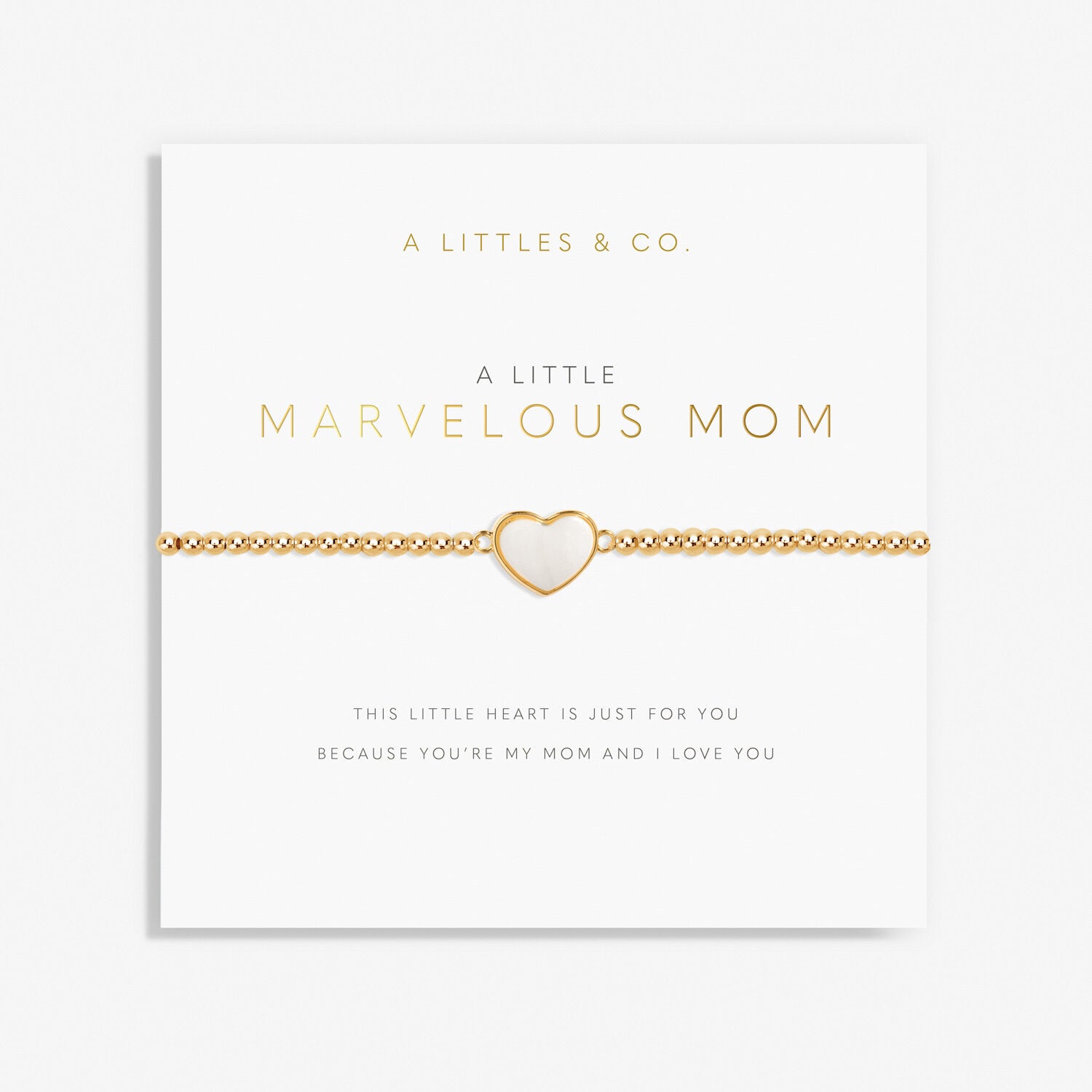 A gold-colored bracelet with a white heart-shaped charm, labeled 'A Littles & Co Marvelous Mom' on a white background. Available at Be Charmed