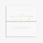 A Littles & Co 'Marvelous Mom' bracelet packaging with a silver-plated charm and a poetic message. Available at Be Charmed