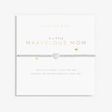 A Littles & Co 'Marvelous Mom' bracelet packaging with a silver-plated charm and a poetic message. Available at Be Charmed