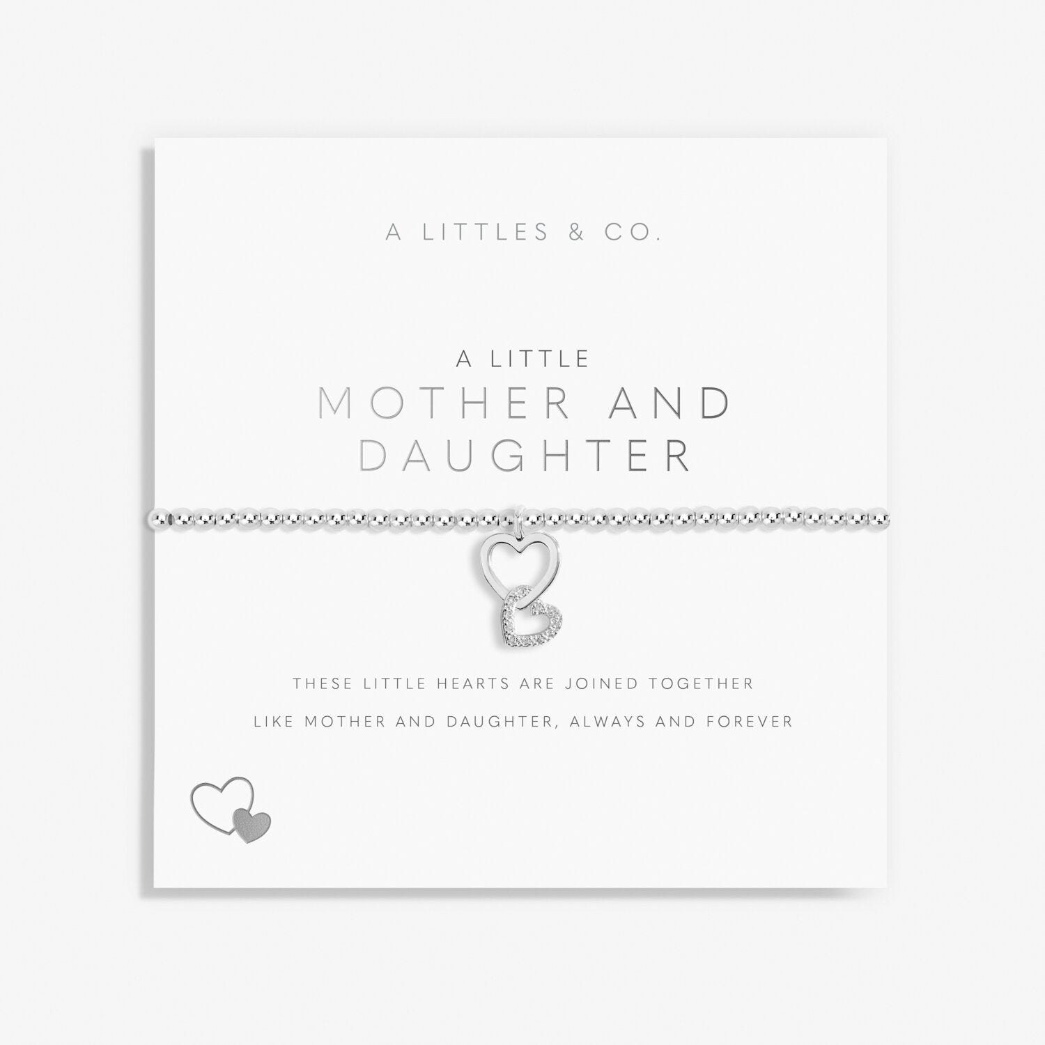 Silver bracelet with interlocking heart charms on a white card with text, featuring 'A Littles & Co' branding. Available at Be Charmed