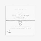Silver bracelet with interlocking heart charms on a white card with text, featuring 'A Littles & Co' branding. Available at Be Charmed