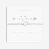 Silver bracelet with heart design on a white card with text, featuring 'A Littles & Co' branding. Available at Be Charmed