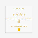 Gold bracelet with lock charm on a white card with 'A Littles & Co.' branding. Available at Be Charmed