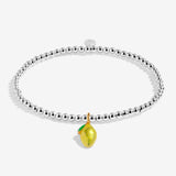 A Littles Company Silver bracelet with a yellow lemon charm on a white background.  Available at Be Charmed