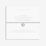 Silver bracelet with a heart charm on a white card with text, displayed on a light gray background. Available at Be Charmed