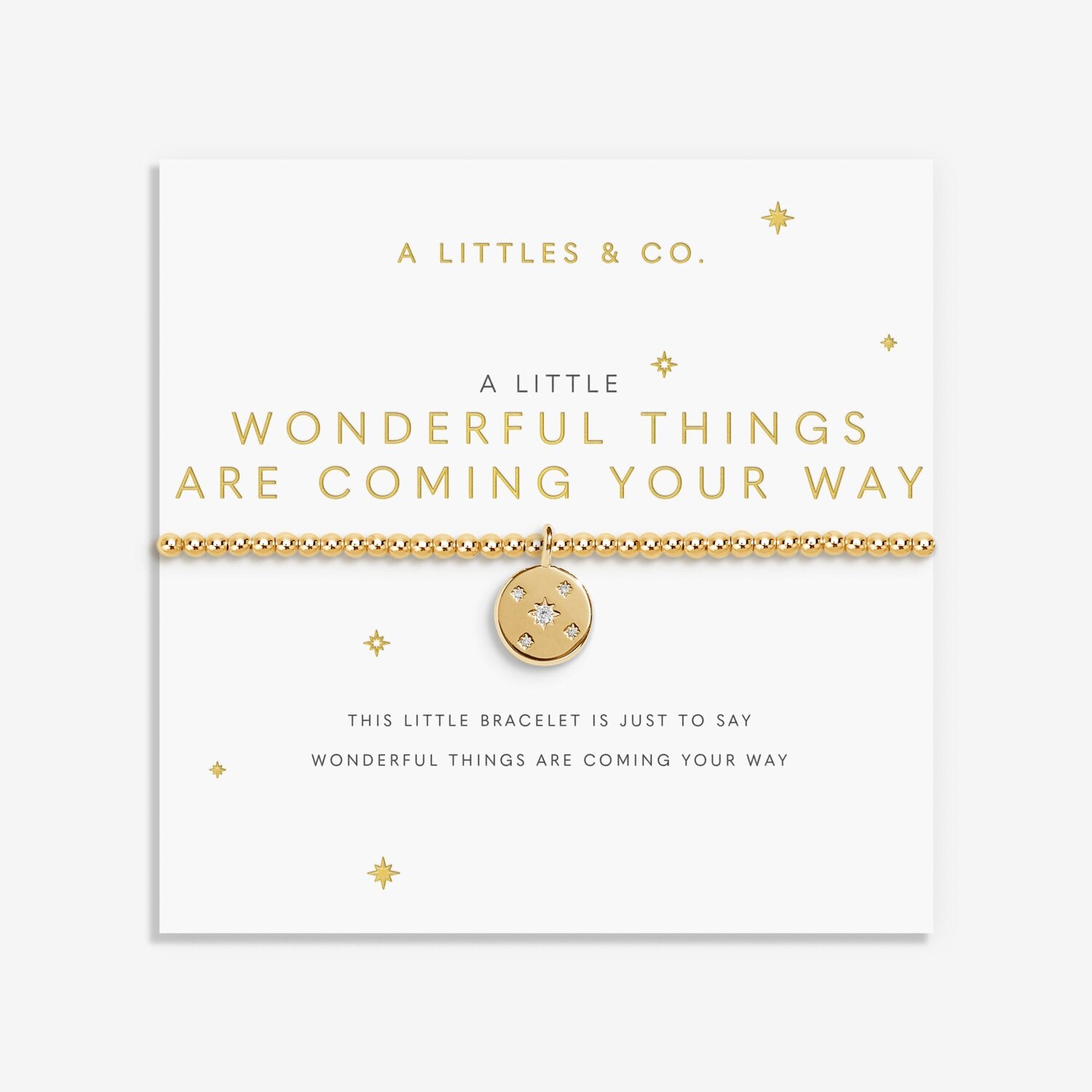 Gold bracelet with a circular charm on a white card with text, featuring 'A Littles & Co.' brand. Available at Be Charmed
