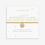 Gold bracelet with a circular charm on a white card with text, featuring 'A Littles & Co.' brand. Available at Be Charmed