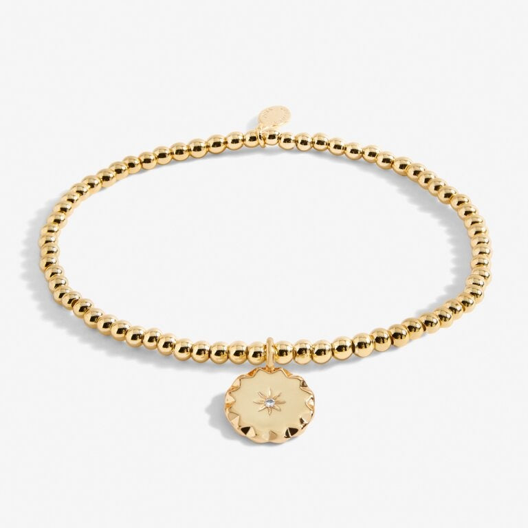 A Littles & Co Gold Darling Daughter Bracelet with a dainty gold heart charm on a stretch bead band, , the perfect keepsake gift for daughters, available at Be Charmed