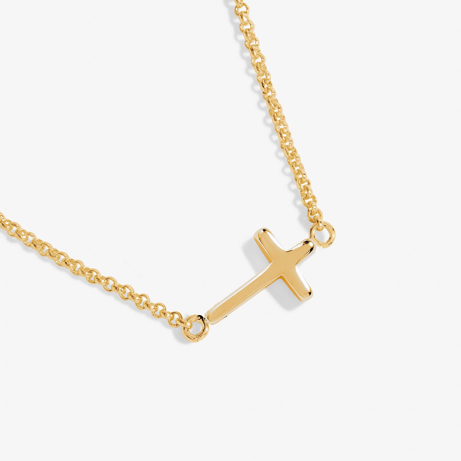 A Littles & Co Gold Faith Necklace featuring a dainty gold-plated cross charm on a fine chain, a meaningful gift of belief and encouragement, available at Be Charmed