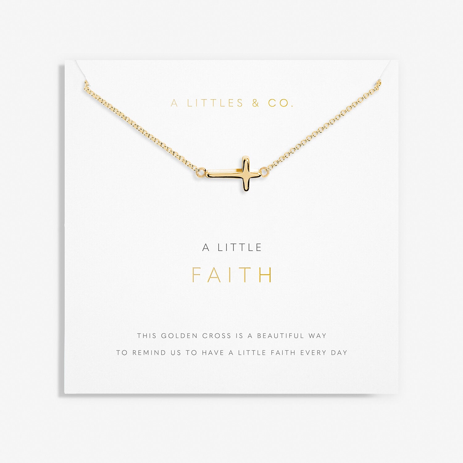 A Littles & Co Gold Faith Necklace featuring a dainty gold-plated cross charm on a fine chain, presented on an inspirational sentiment card, a meaningful gift of belief and encouragement, available at Be Charmed