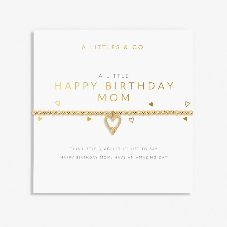 A Littles & Co Gold Happy Birthday Mom Bracelet featuring a delicate gold-plated heart charm on a stretch bead band, displayed on a heartfelt birthday message card, a sentimental gift for moms, available at Be Charmed