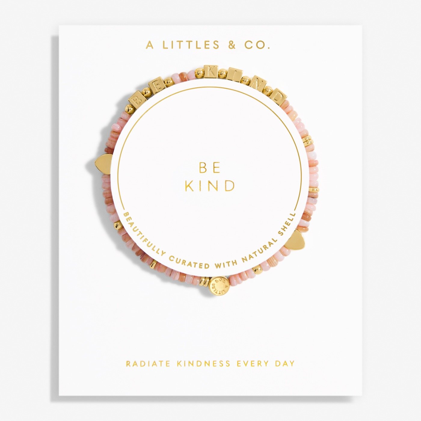 A Littles & Co. Bracelet with 'Be Kind' message on a white background, featuring gold and pink beads. Available at Be Charmed